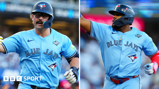 Toronto Blue Jays batters Davis Schneider and Vladimir Guerrero Jr celebrate hitting their first-inning home runs