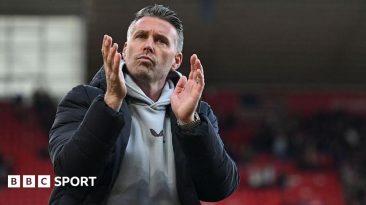 Rob Edwards claps the fans at Middlesbrough