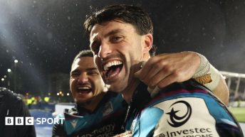 Sione Tuipulotu and Adam Hastings celebrate after Glasgow's win over Toulouse