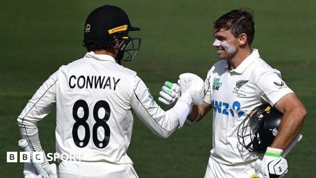 Dean Conway (left) congratulates Tom Latham on his century