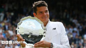 Milos Raonic hols the 2016 Wimbledon runners-up plate