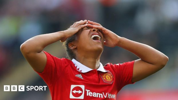 Leicester players lift the Premier League title