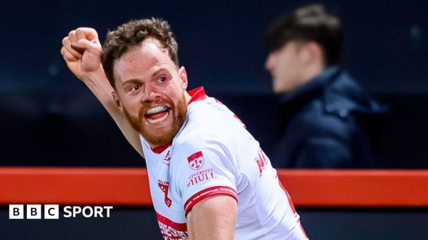 Hull KR wing Joe Burgess punching the air in delight after scoring a try.