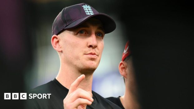 Harry Brook talks to his team