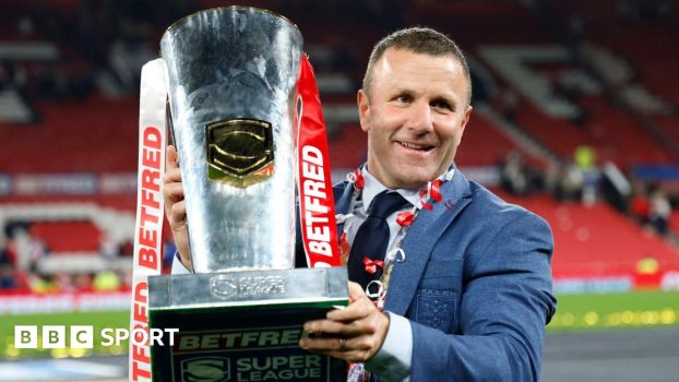 Hull KR coach Willie Peters holds the Super League trophy