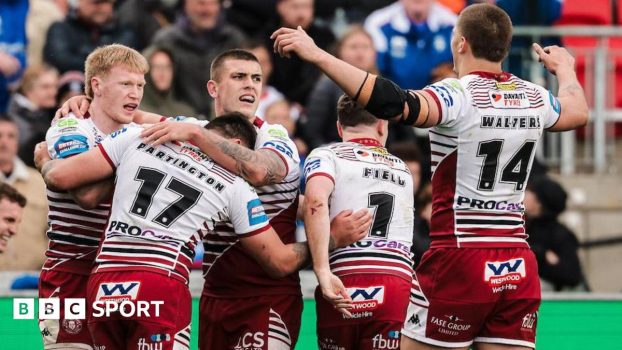Zach Eckersley facing his team mates as he celebrates scoring a try for Wigan Warriors against Wakefield Trinity.