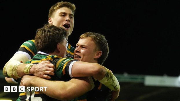 Northampton players celebrate a try
