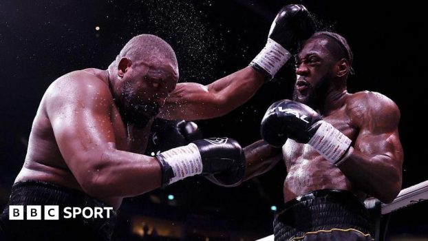 Derek Chisora is punched by Deontay Wilder