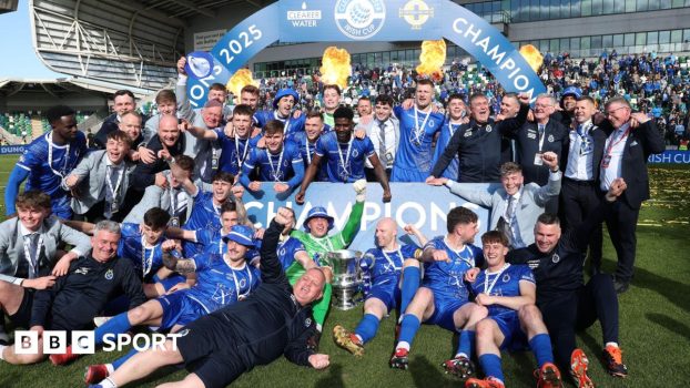 Dungannon Swifts players and officials celebrate last year's Irish Cup final win