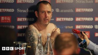 Mark Williams naked surrounded by microphones after winning his third world title in 2018