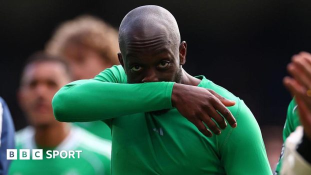 Yoane Wissa wipes his nose on his arm