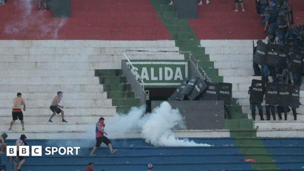 Police fire tear gas in an attempt to quell trouble during a game between Olimpia and Cerro Porteno in the Paraguay captial Asuncion.