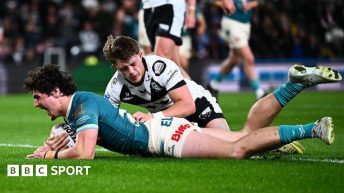 Jake Davies roars with delight after diving over the line to ground the ball for his first Super League try