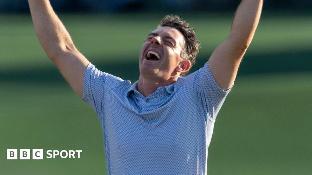Rory McIlroy celebrates winning the Masters title