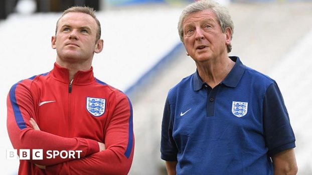 Wayne Rooney stands with England manager Roy Hodgson at Euro 2016