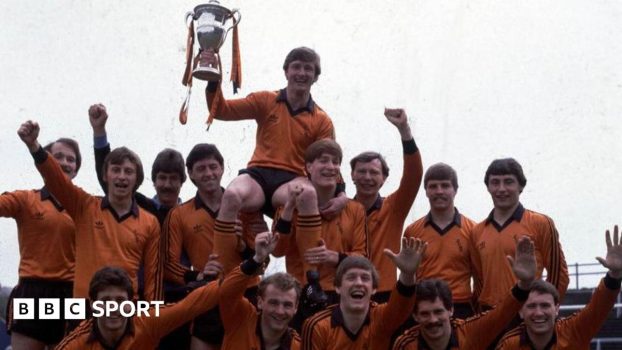 The statue of Jim McLean holding the 1983 Premier Division trophy, which was erected outside Tannadice in 2021
