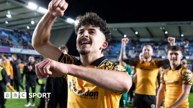 Hull City winger Mohamed Belloumi celebrates in front of his team-mates after their 2-0 win at Millwall