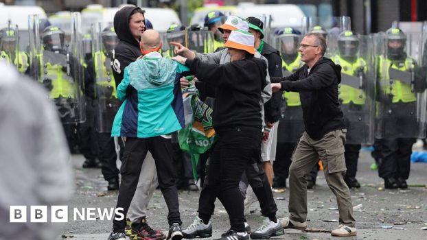 Police pelted with bottles as Celtic fans celebrate Premiership title win