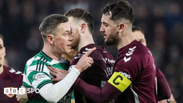 Celtic's Callum McGregor clashes with Hearts' Blair Spittal (not in frame) during a William Hill Premiership match between Heart of Midlothian and Celtic at Tynecastle Park, on January 25, 2026, in Edinburgh, Scotland.