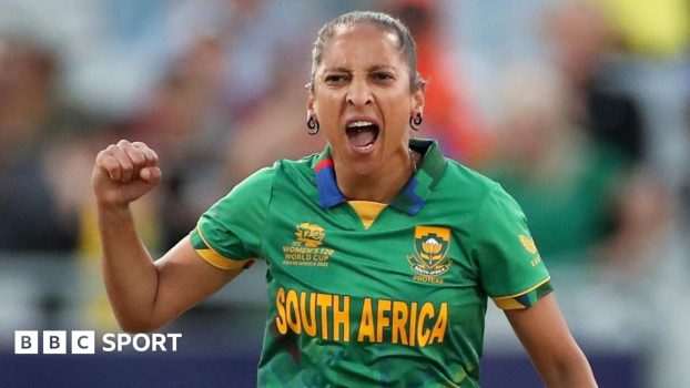 Shabnim Ismail, wearing a green South Africa kit, celebrates a wicket